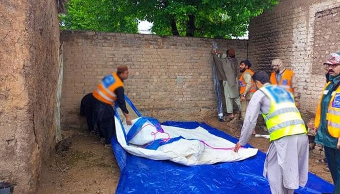 In this file image, rescue personnel can be seen working. — Geo News/File