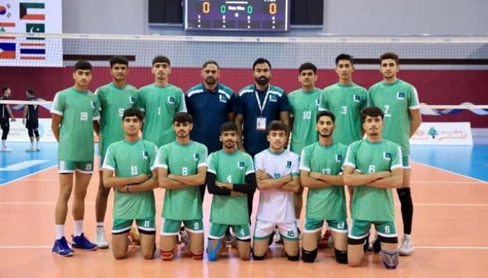 Pakistan volleyball team players and officials pose for a picture during the 15th Asian Mens U18 Volleyball Championship in Bahrain. — Reporter