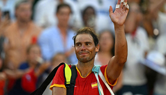 Spain’s Rafael Nadal waves as he leaves after he and Spain’s Carlos Alcaraz beat Netherlands’ Tallon Griekspoor and Netherlands’ Wesley Koolhof in their men’s doubles second round tennis match on Court Suzanne-Lenglen at the Roland-Garros Stadium during the Paris 2024 Olympic Games, in Paris on July 30, 2024. — AFP