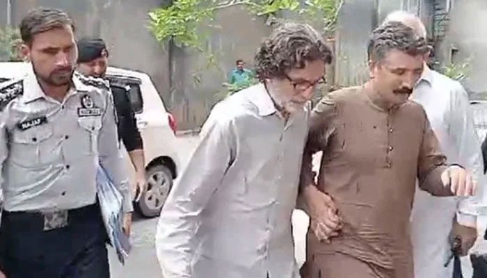 PTI Information Secretary Raoof Hasan walks as he is presented before a court for a hearing in Islamabad on July 28, 2024. — YouTube/Geo News/Screengrab