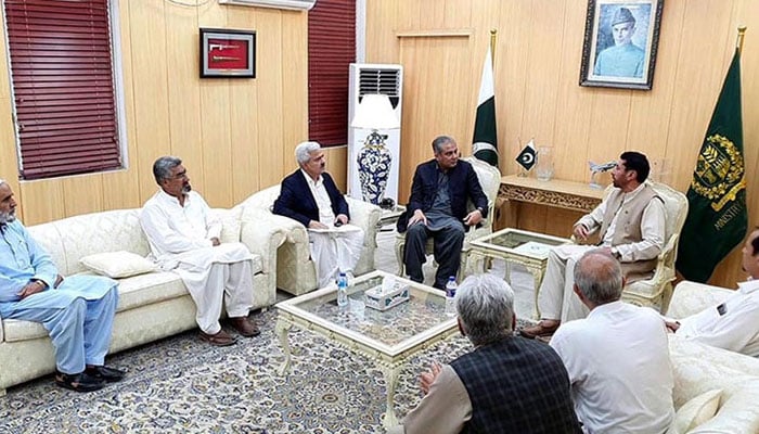 Interior Minister Mohsin Naqvi (centre left) meets a delegation from Kurram led by MNA Hamid Hussain (centre right) in Islamabad in this image released on August 1, 2024. — State media