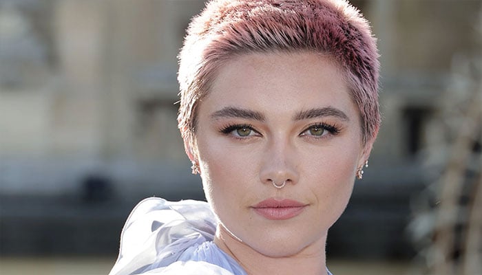 Florence Pugh leaves theatre with handsome companion.