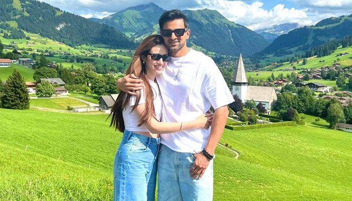 Actress Sana Javed poses with her husband and veteran cricketer Shoaib Malik in Switzerland. — Instagram/@sanajaved.official