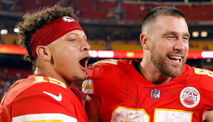 Travis Kelce and Patrick Mahomes wave to fans with Morgan Wallen.