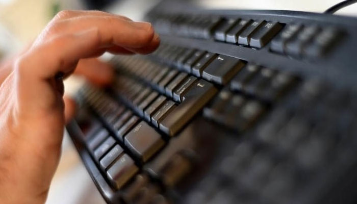 This representational image shows an employee typing on a computer keyboard at the headquarters of Internet security giant Kaspersky in Moscow. — AFP/File