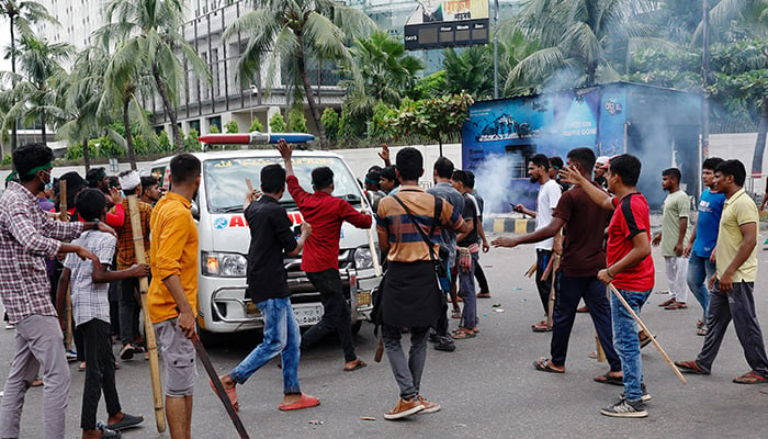 Demonstrators stop an ambulance to check whether there are any patients inside before allowing it to leave during a protest demanding the stepping down of Bangladeshi Prime Minister Sheikh Hasina, following quota reform protests by students, in Dhaka, Bangladesh, August 4, 2024. — Reuters