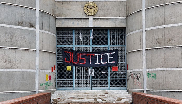 A banner hangs on the entrance of the Parliament Building a day after the resignation of Bangladeshi Prime Minister Sheikh Hasina, in Dhaka, Bangladesh, August 6, 2024. — Reuters