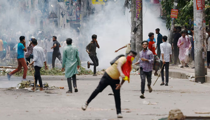 Protesters clash with Border Guard Bangladesh (BGB) and the police outside the state-owned Bangladesh Television as violence erupts across the country after anti-quota protests by students, in Dhaka, Bangladesh, July 19, 2024. — Reuters