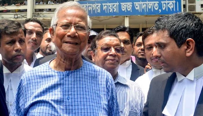 Bangladeshs Nobel Laureate Muhammad Yunus (centre) addresses the media at Special Judge Court in Dhaka in this undated photo. — AFP