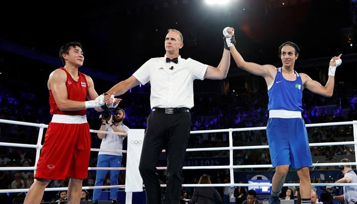 Referee raises the arm of Imane Khelif of Algeria after winning her fight against Janjaem Suwannapheng of Thailand on August 6, 2024. — Reuters