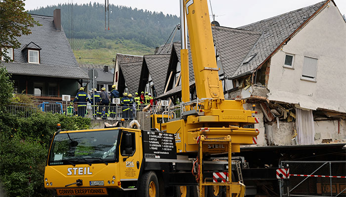 German rescue officials at work at the Reichsschenke Zum Ritter Goetz after it collapsed overnight near the banks of Germanys river Moselle in Kroev, Germany on August 7, 2024. — Reuters