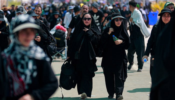 Iranian Shiite pilgrims arrive at the Zurbatiyah border crossing between Iran and Iraq on August 28, 2023. — AFP