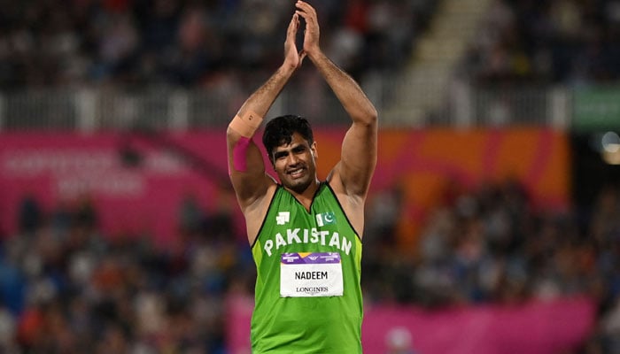 Pakistans Arshad Nadeem celebrates winning the gold medal in the mens javelin throw final athletics during the Commonwealth Games at the Alexander Stadium, in Birmingham, central England, on August 7, 2022. — AFP