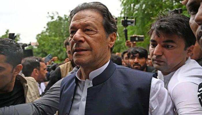 Former prime minister Imran Khan arrives to appear before an anti-terrorism court in Islamabad on August 25, 2022. — AFP