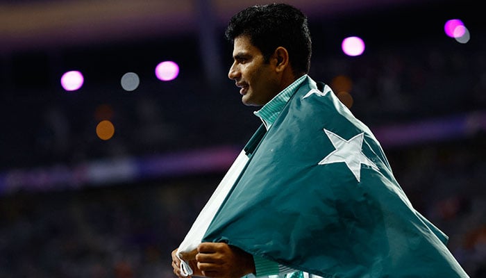 Arshad Nadeem of Pakistan celebrates after winning gold and setting a new Olympic record in Stade de France, Saint-Denis, France on August 8, 2024. — Reuters