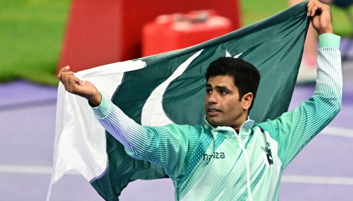 First placed Pakistans Arshad Nadeem celebrates after competing in the mens javelin throw final of the athletics event at the Paris 2024 Olympic Games at Stade de France in Saint-Denis, north of Paris, on August 8, 2024. — AFP