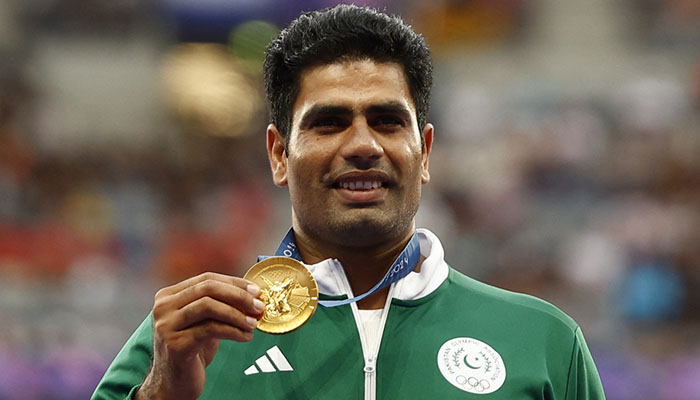 Gold medalist Arshad Nadeem of Pakistan celebrates with his medal on the podium at Mens Javelin Throw Victory Ceremony in the Stade de France, Saint-Denis, France on August 09, 2024. — Reuters