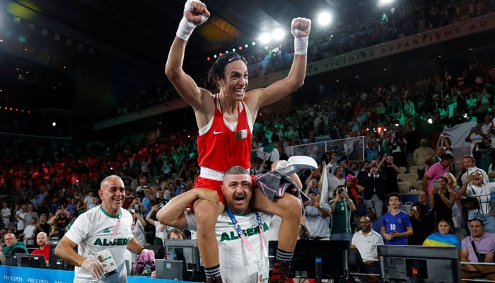 Imane Khelif of Algeria celebrates winning against Liu Yang of China on August 9, 2024. —Reuters