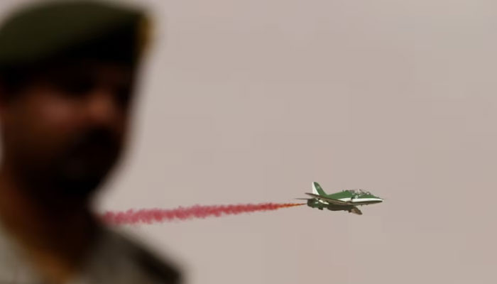 A member of Saudi security forces attends Abdullahs Sword military drill as a jet flies by in Hafar Al-Batin, near the border with Kuwait. — Reuters/File