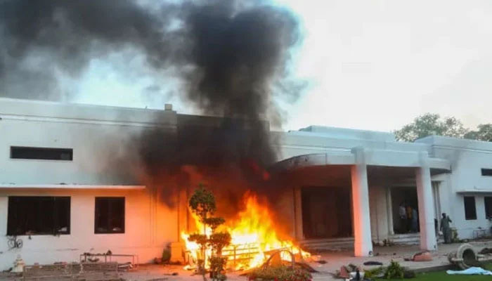 Furniture burns outside the Lahore Corps Commander Houses building in Lahore on May 9, 2023. — Reuters