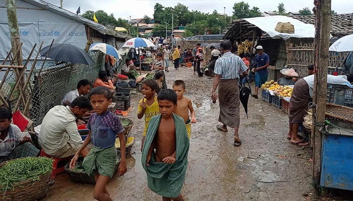 Rohingya refugees walk along a path at Kutupalong refugee camp in Ukhia, Bangladesh, Aug. 25, 2021. —  AFP