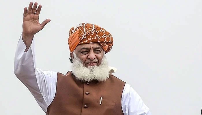 JUI-F chief Fazl-ur-Rehman waving at an event. — AFP/File