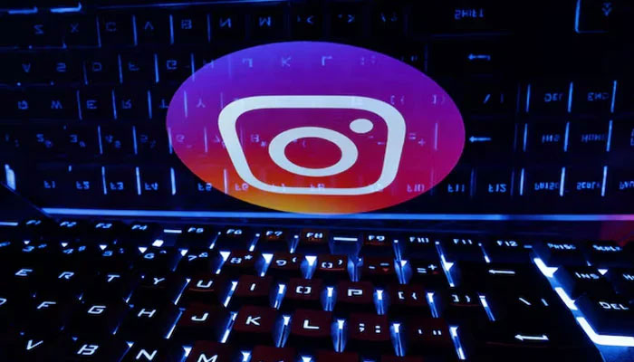 A keyboard is placed in front of a displayed Instagram logo in this illustration taken February 21, 2023. — Reuters