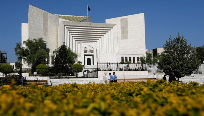 Police officers walk past the Supreme Court of Pakistan building, in Islamabad, Pakistan April 6, 2022. — Reuters