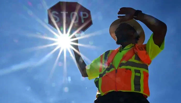 The image shows a guard standing in the scorching sun as brutal heat waves hit parts of Europe. — AFP/File