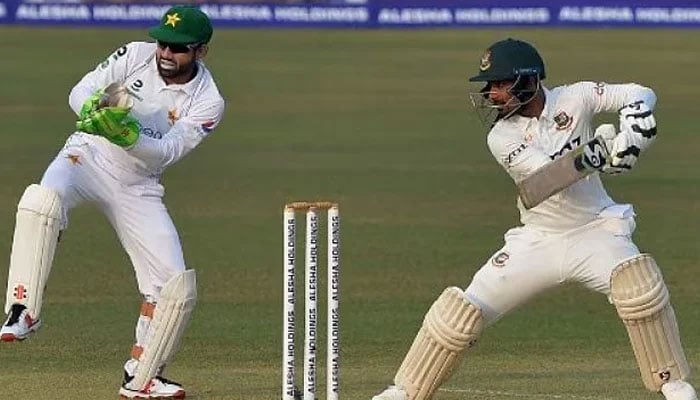 Pakistans Mohammad Rizwan reacts as a Bangladesh player plays a shot during a Test match. — AFP/File