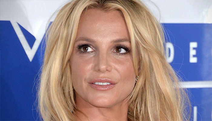 Britney Spears reflects on her iconic hair journey.