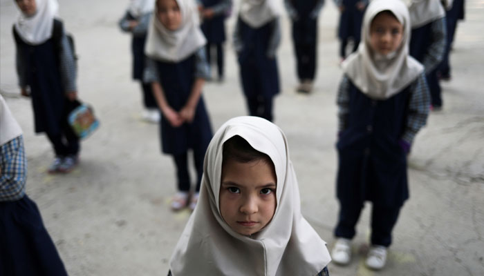 Afghan girls look on at a school in Kabul, Afghanistan, September 18, 2021. — Reuters