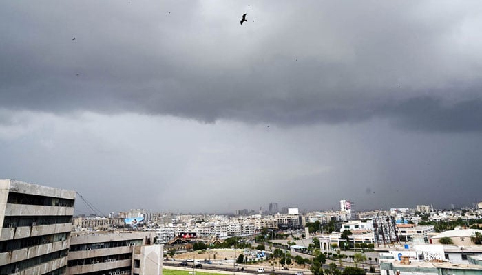 Nimbostratus clouds cover the sky in a dark gray layer over the metropolis, heralding the imminent arrival of rain in Karachi on July 19, 2024. — APP