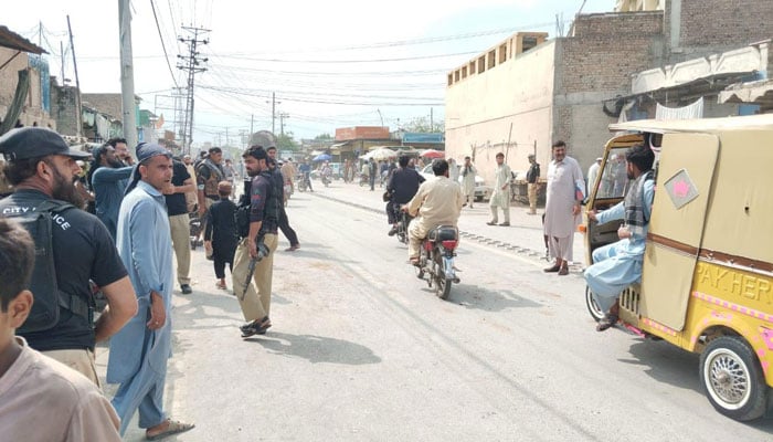 People gather at the site of the blast at Warsak Road in Peshawar on August 16, 2024. — Geo News