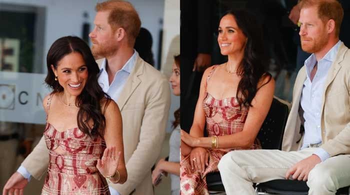 Prince Harry looks uncomfortable next to smiling Meghan Markle in new dance video