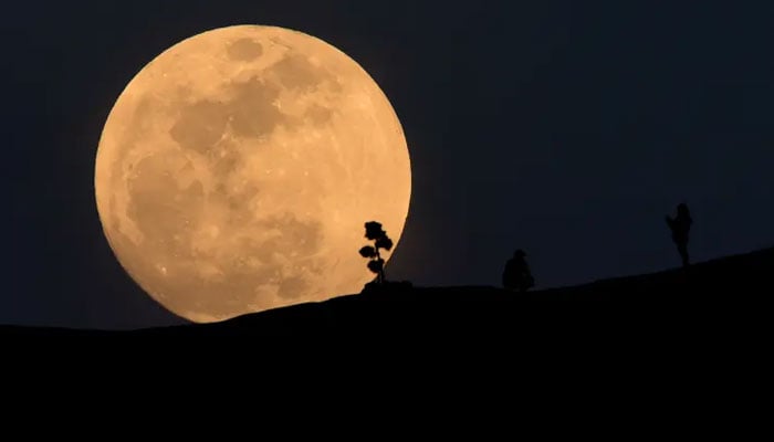 Earths satellite reaches a rare milestone on the celestial calendar this weekend with Sunday, August 22s seasonal blue sturgeon moon. — AFP/File