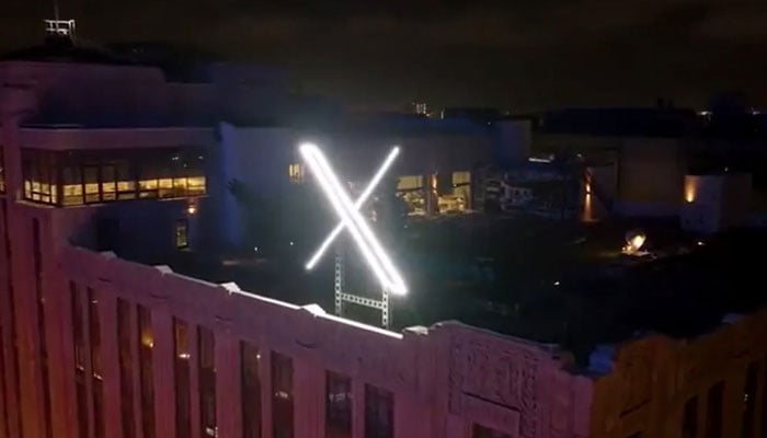 The logo of X, formerly Twitter, can be seen on top of a building in this undated image. — X/File