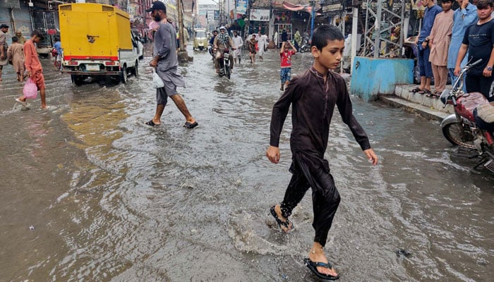 Commuters are facing difficulties in transportation due to stagnant rainwater after heavy downpour in Sukkur on Saturday, August 17, 2024. — PPI