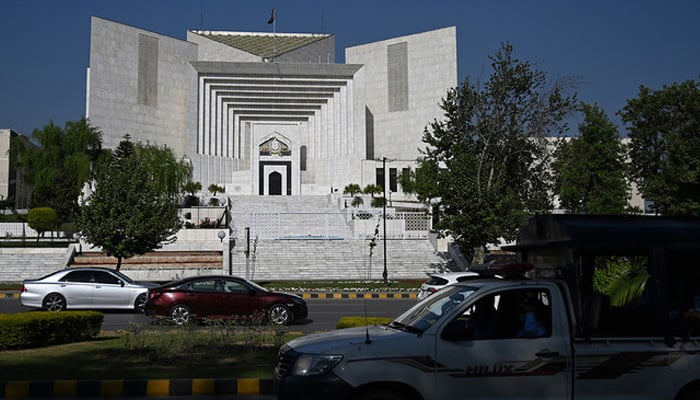 Motorists drive past the Supreme Courts building in Islamabad on April 5, 2022. — AFP/File