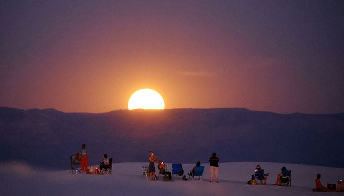 People gather to watch the Supermoon in White Sand National Park near Alamogordo, New Mexico, U.S., August 19, 2024. — Reuters