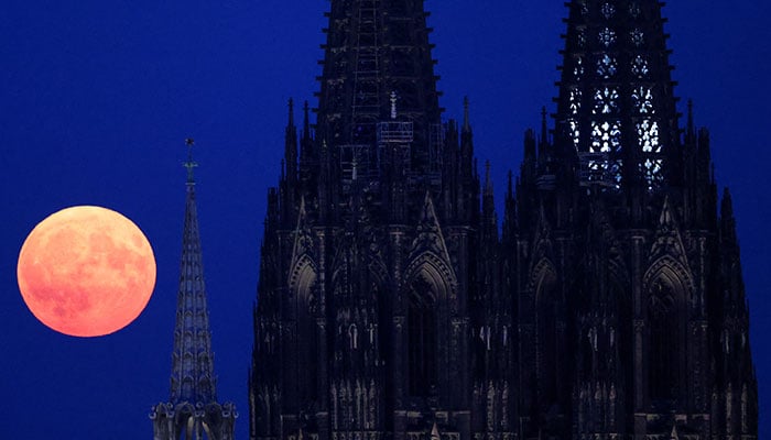 A supermoon rises behind the Cologne Cathedral in Cologne, Germany, August 19, 2024. — Reuters