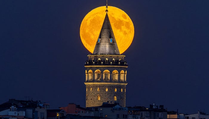 A supermoon rises over the historical Galata Tower in Istanbul, Turkey, August 19, 2024. — Reuters