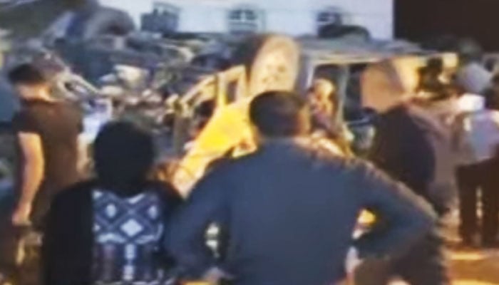 Rescue officials are shifting the injured and the bodies to the hospital after the accident in this still taken from a video. — YouTube/Geo News