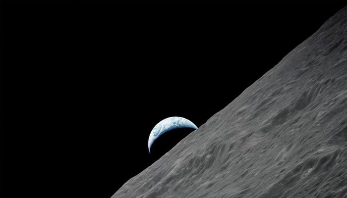 The crescent Earth rises above the lunar horizon in this undated NASA handout photograph taken from the Apollo 17 spacecraft in lunar orbit during the final lunar landing mission in the Apollo program in 1972. —Reuters