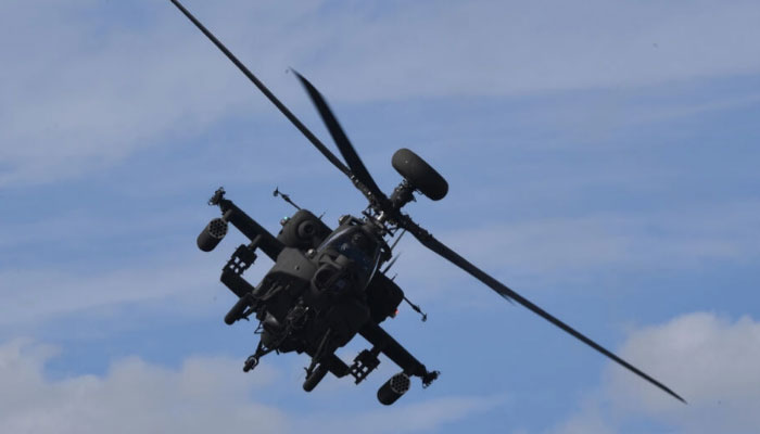 This undated photo shows an Apache helicopter flies. — AFP