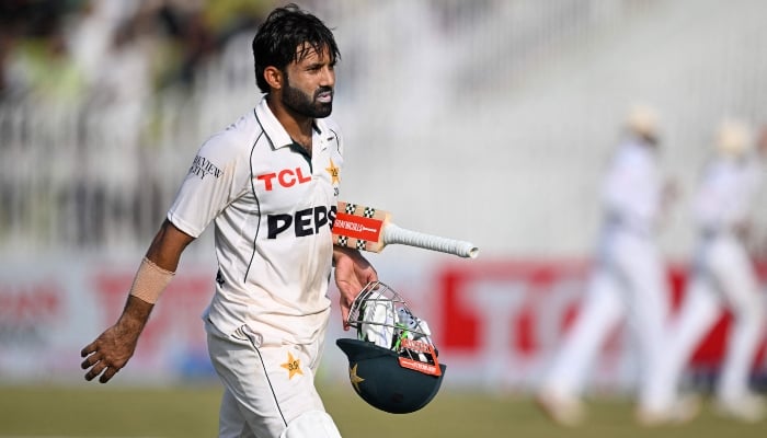 Mohammad Rizwan walks back to the pavilion at the end of first innings of first Test cricket match between Pakistan and Bangladesh at the Rawalpindi Cricket Stadium in Rawalpindi on August 22, 2024. —AFP