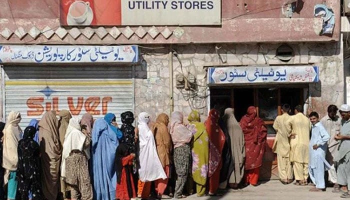 A long queue of people is seen outside a utility store in an undated picture. — AFP/File