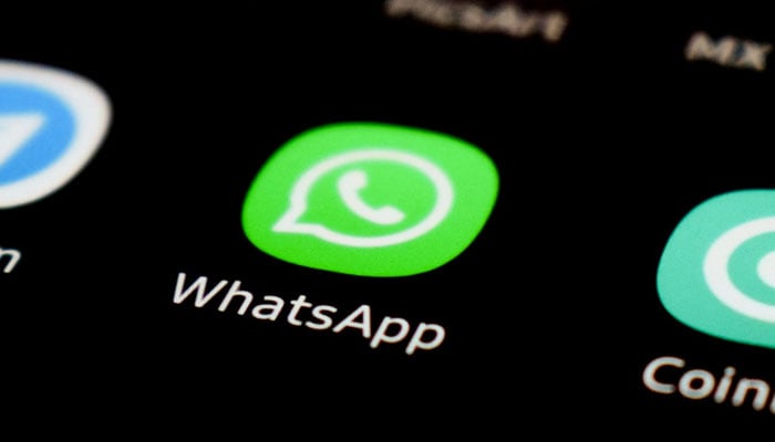 A representational image showing the WhatsApp icon displayed on a phone screen. — Unsplash