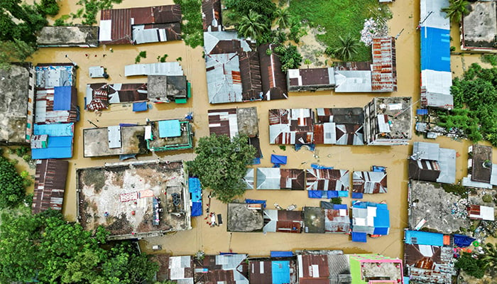 An aerial view shows partially submerged houses after flood in Feni on August 24, 2024. — AFP