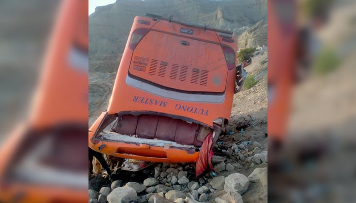 The ill-fated bus carrying pilgrims to Iran lies upside down after plunching into a ditch at the Makran Coastal Highway on August 25, 2024. — Reporter